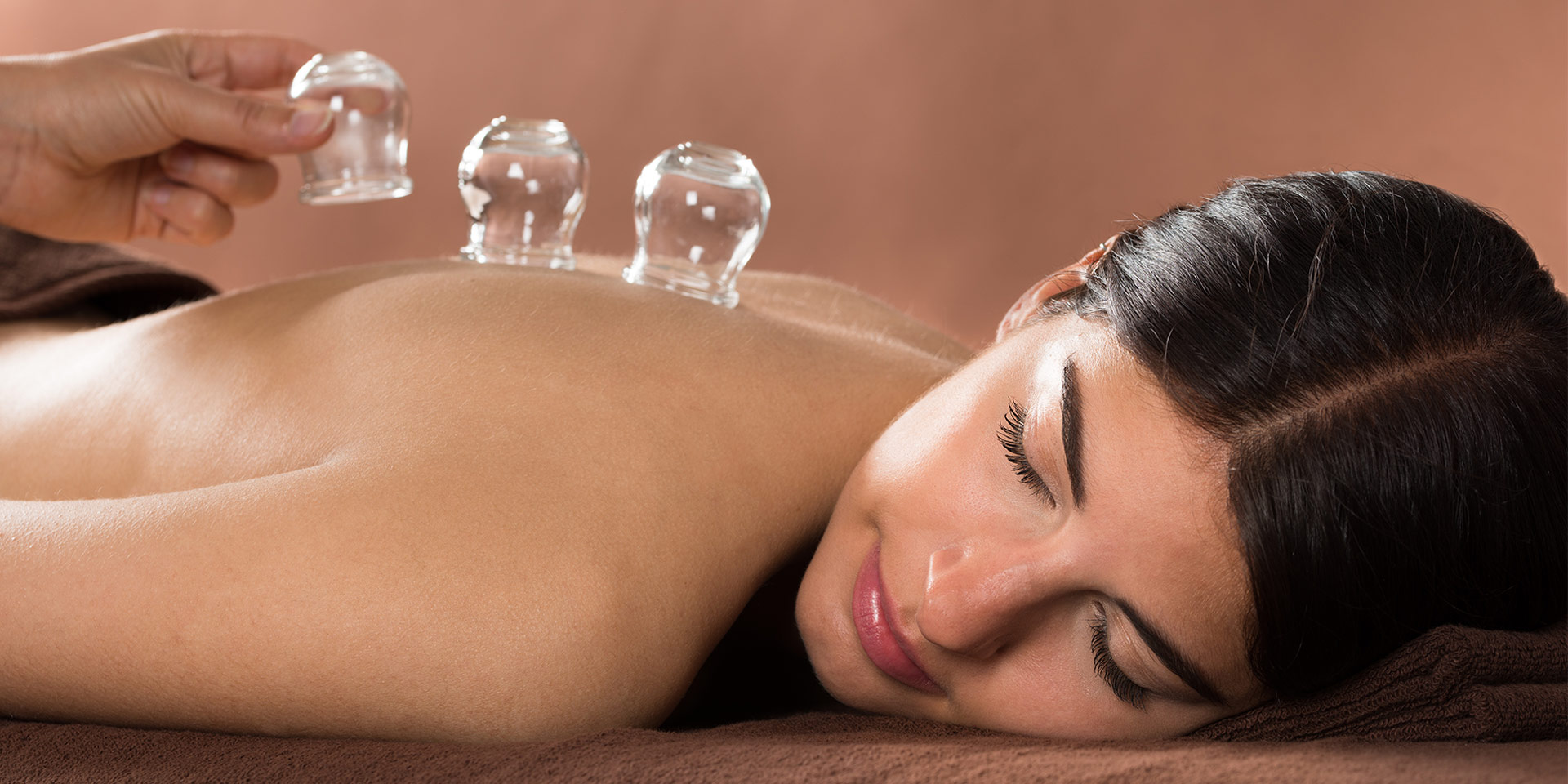 a woman enjoying a holistic integrative therapy treatment.