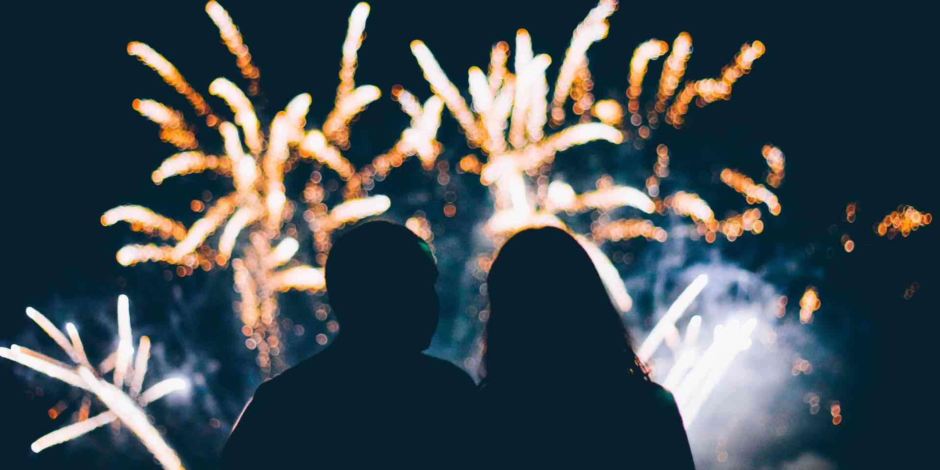 Two people watching fireworks